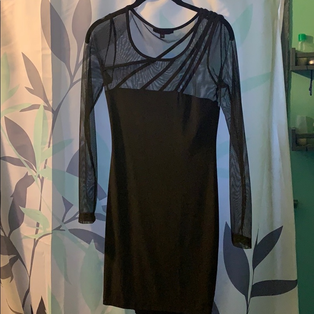 Little black dress, sheer on top.